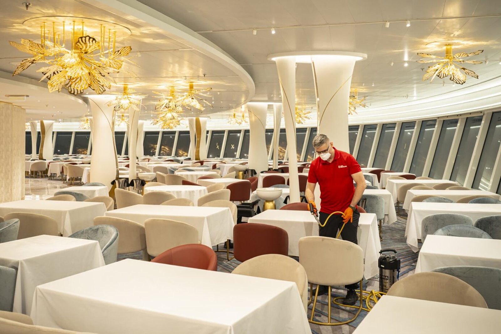 Fiber ProTector technician impregnating chairs in a cruise ship restaurant