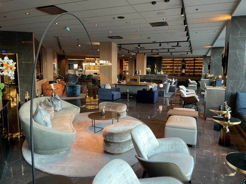 Suite with sea view — velvet sofa and curtains