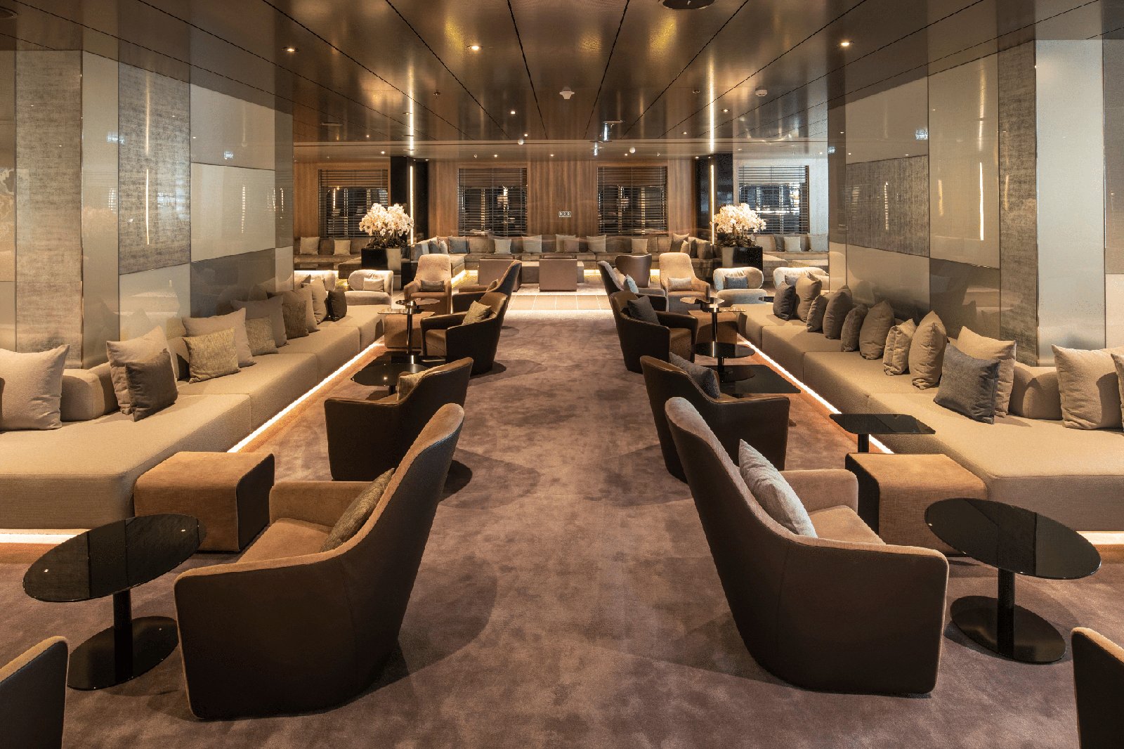 Elegant hotel lounge with soft upholstered furniture and carpet