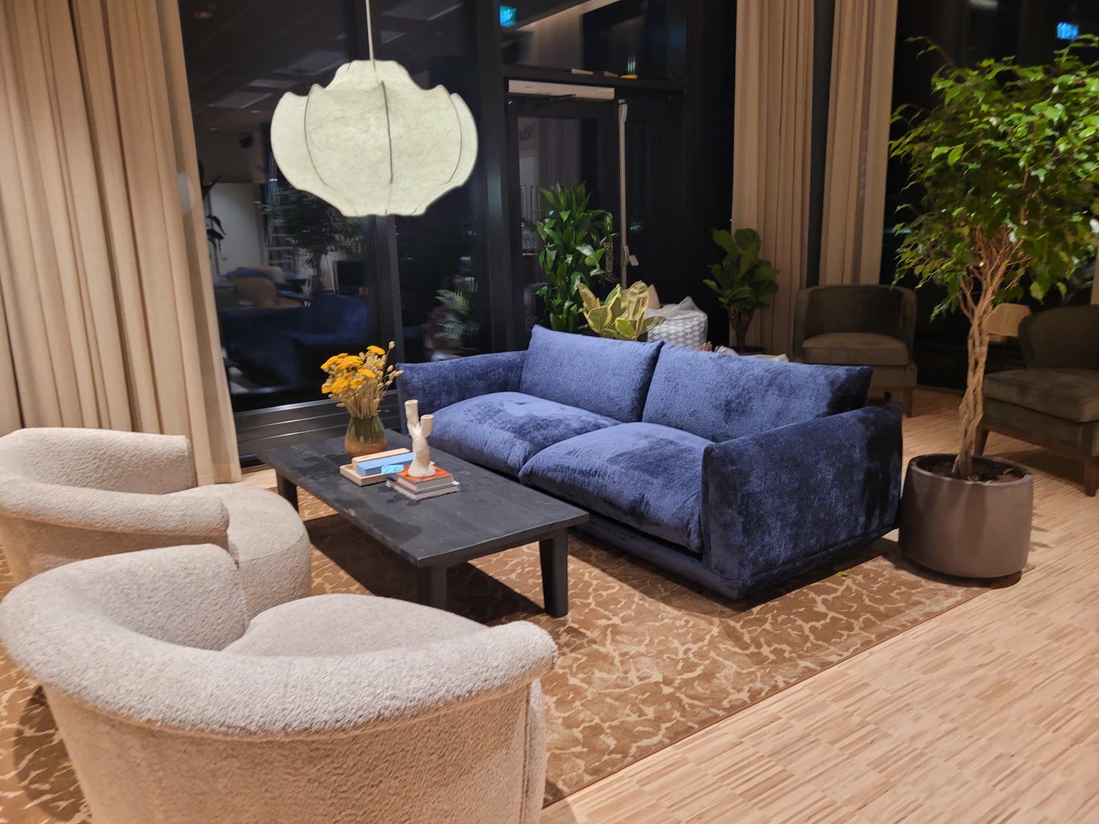 Lobby seating groups in green and navy textile