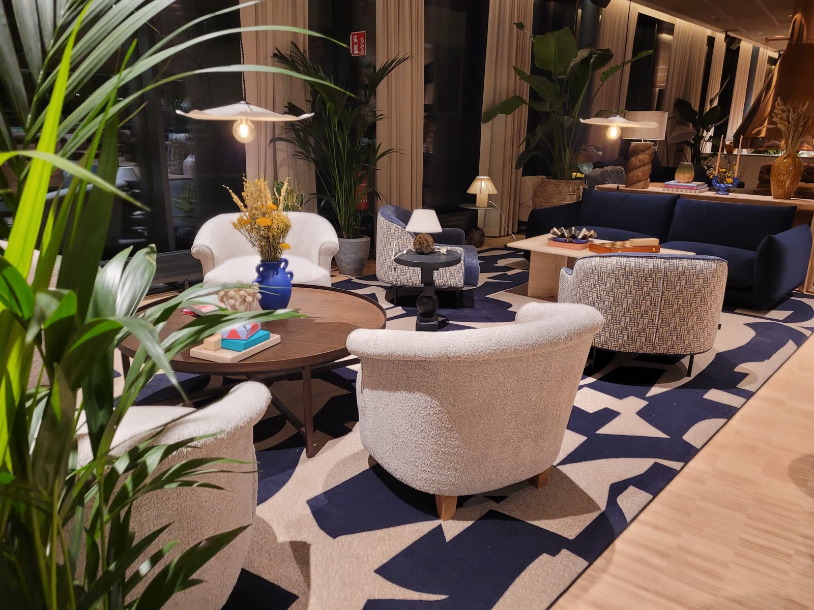 Lobby lounge with boucle chairs and patterned carpet