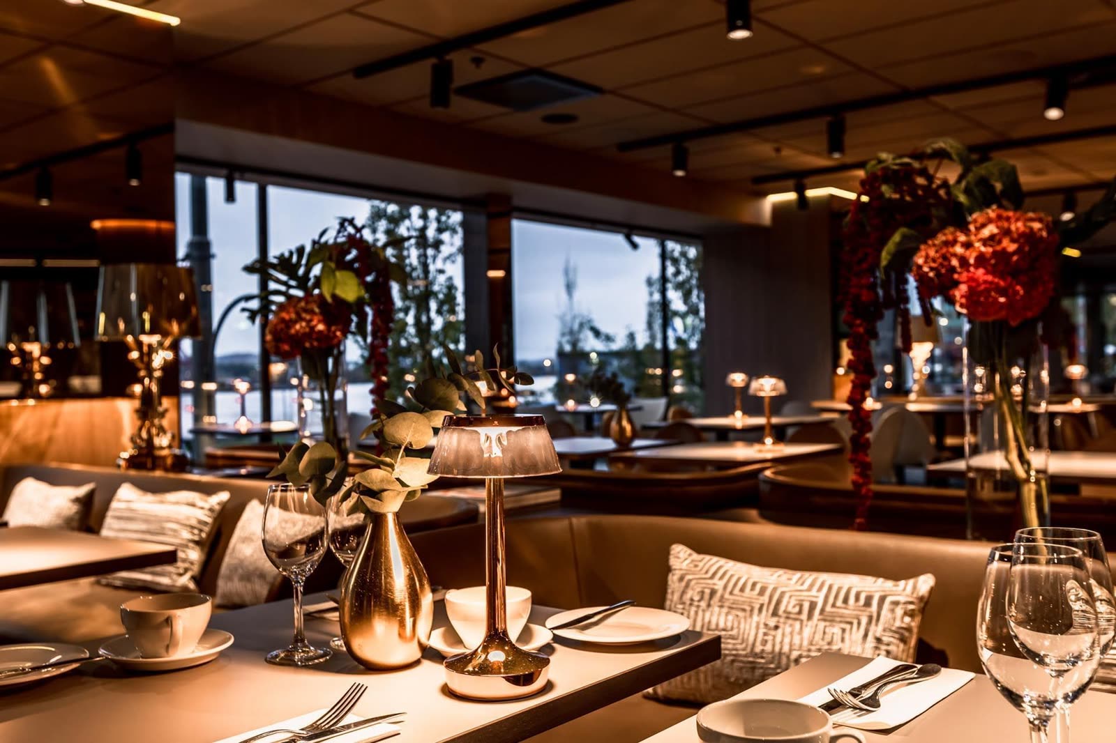 Restaurant at dusk — protected seating section in golden light