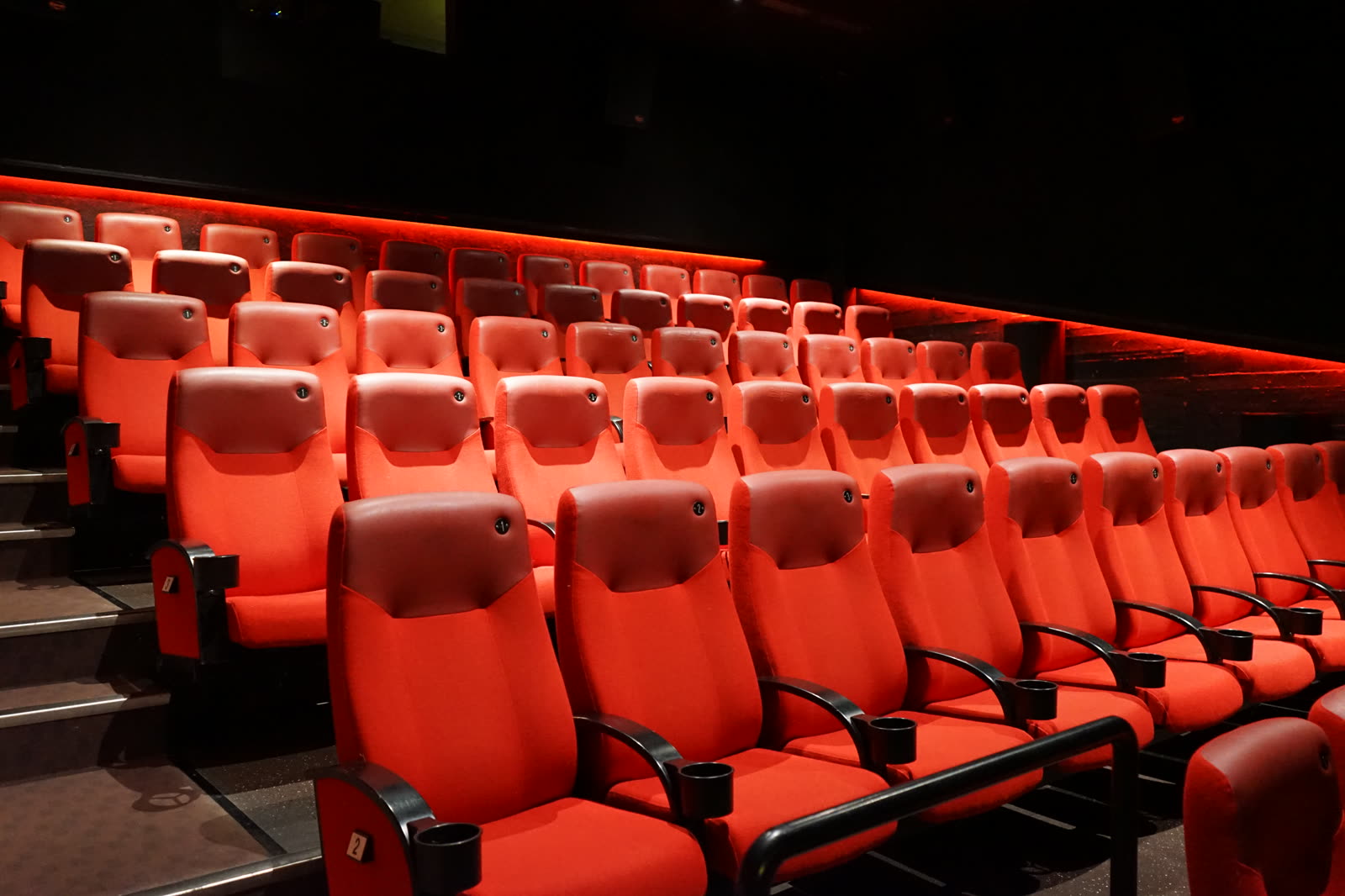 Red cinema seats in an auditorium — protected and ready for use