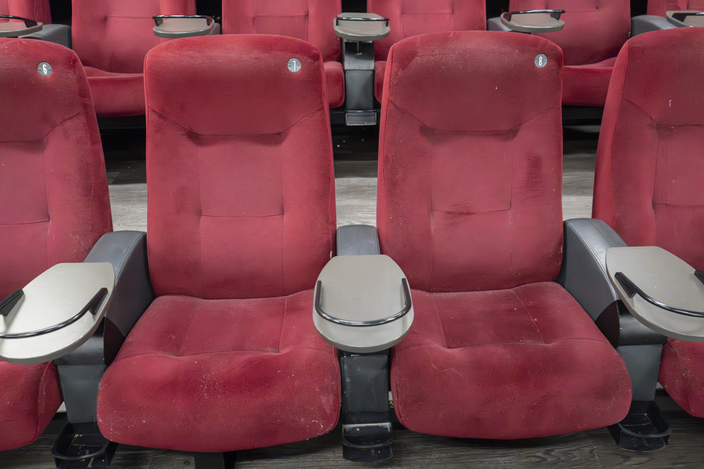 Before treatment – red cinema seats with dust and wear
