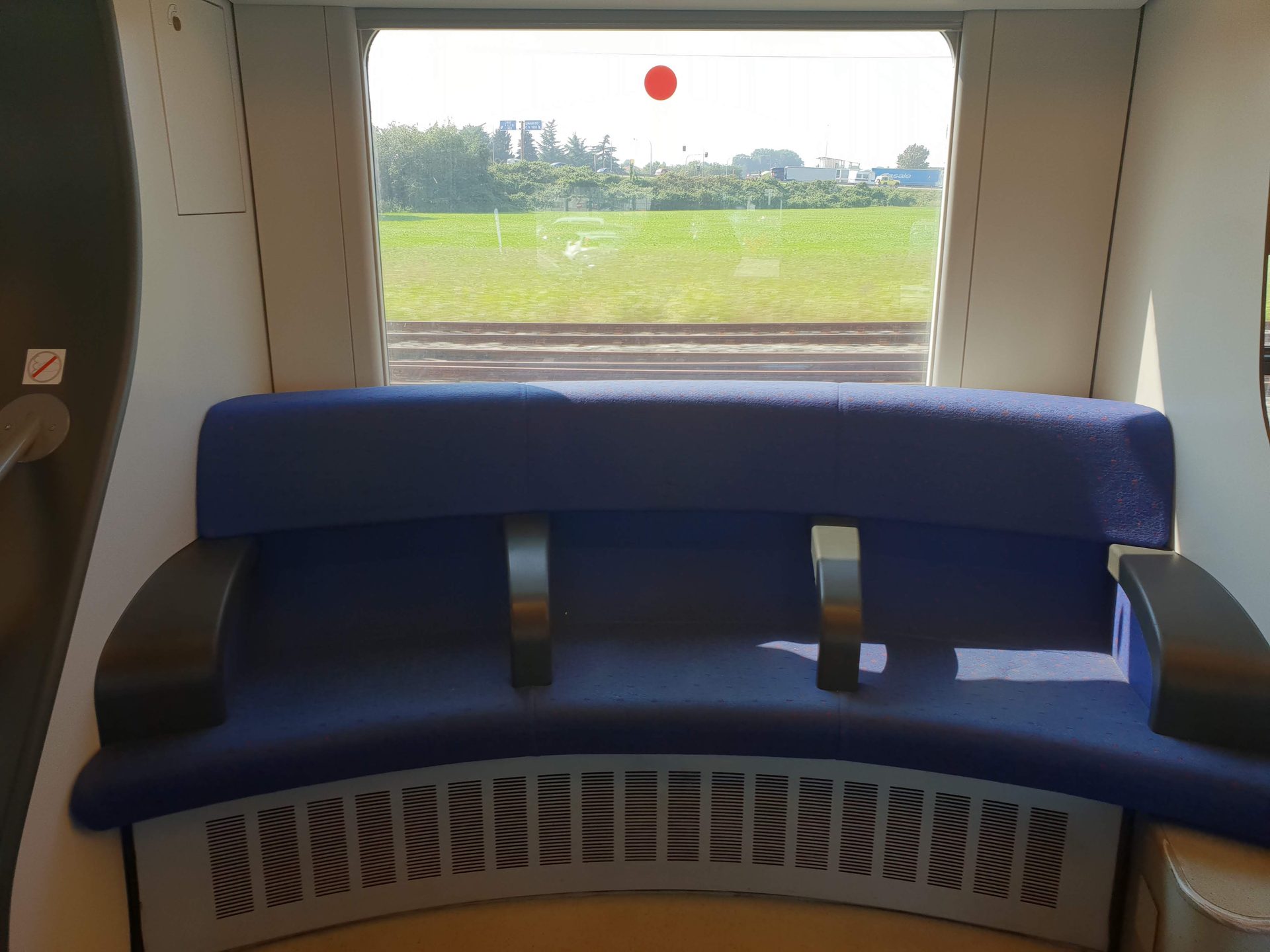 Treated seat cover on a train — a tight weave built for daily use